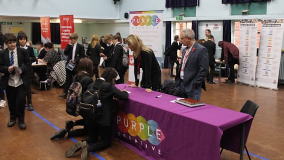 Pupils engaged in conversation with Purple Creative.