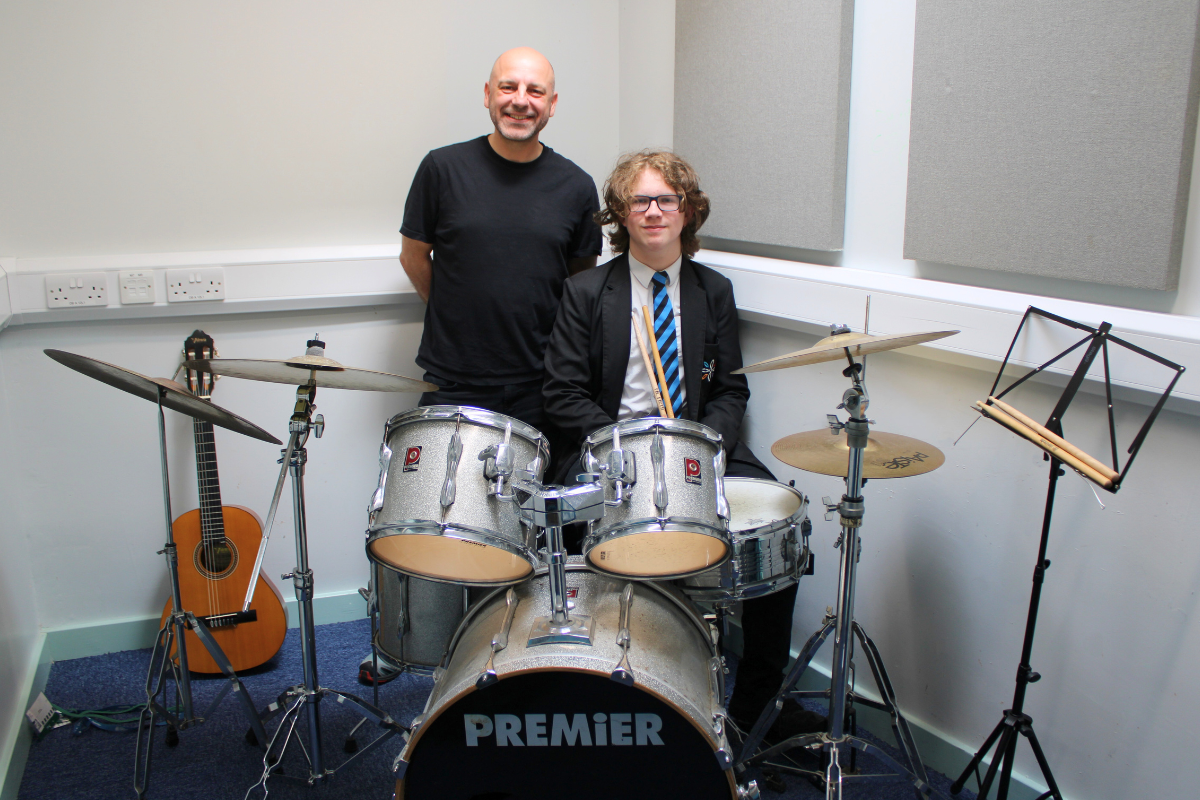 Alex Achieves Distinction in Grade 4 Drum Kit Exam