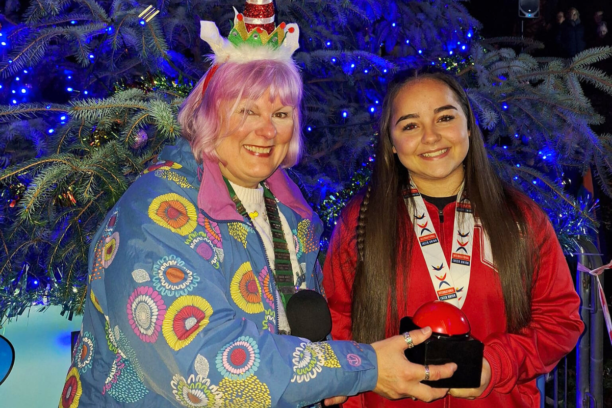 Gold Medalist Turns on Christmas Lights
